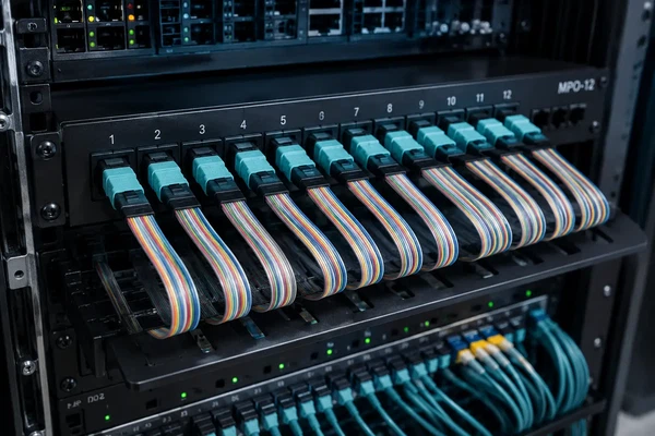 Ribbon-structured MPO connectors in a data center rack Ribbon-structured MPO connectors in a data center rack